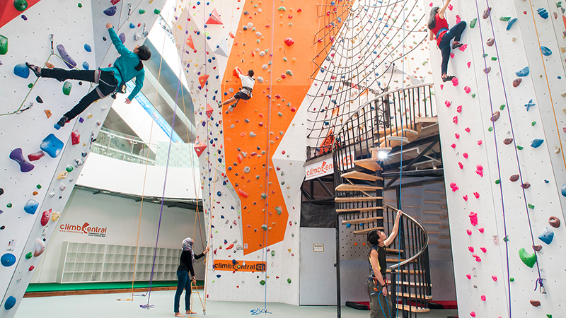 Climbers working their way up the walls at Climb Central